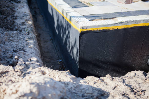 Professional Waterproofing technician working in Raymond, WI